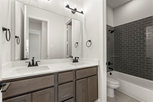 2109 Stratford Rd, Rockwall, TX 75087 - bathroom with double vanity, toilet, washtub / shower combination, and tile patterned floors