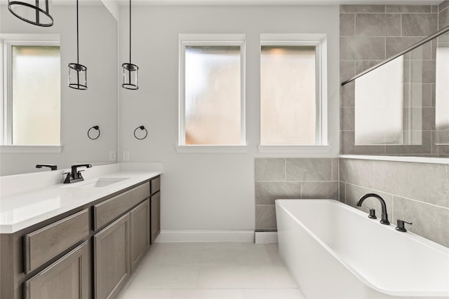 2109 Stratford Rd, Rockwall, TX 75087 - full bath featuring healthy amount of natural light, a soaking tub, and vanity