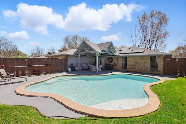 view of swimming pool with a patio area and a fenced backyard