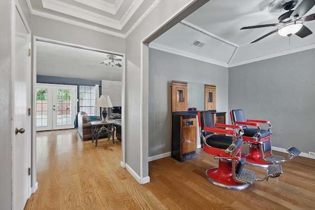 recreation room featuring a ceiling fan, wood finished floors, french doors, and ornamental molding