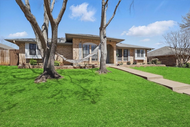 view of front of home featuring brick siding