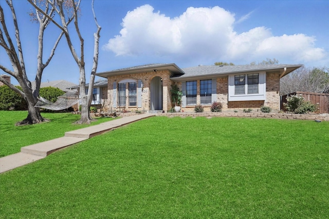 ranch-style home featuring brick siding