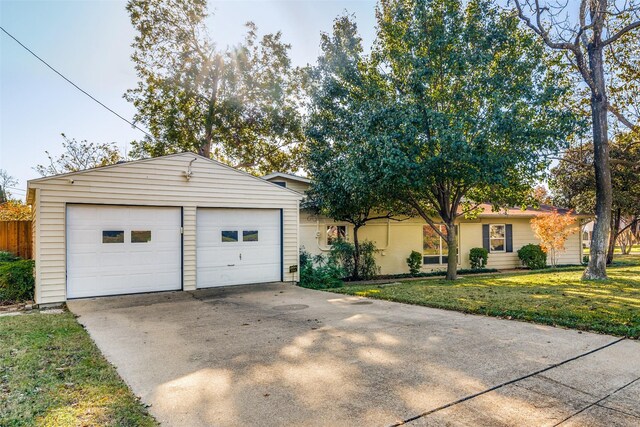 9705 Twin Creek Dr, Dallas, TX 75228 - ranch-style house with a front yard and a detached garage