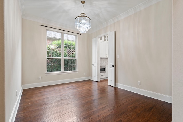 2220 Emerson Ln, Carrollton, TX 75010 - spare room with crown molding, a chandelier, and dark wood-style floors