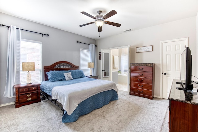 bedroom with carpet floors, multiple windows, and visible vents