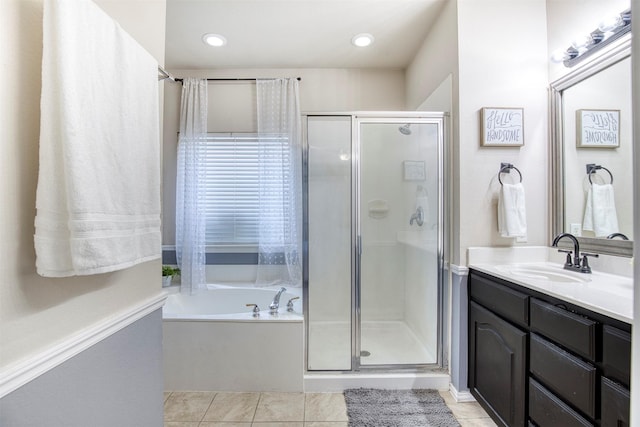 bathroom with vanity, tile patterned floors, a shower stall, and a bath