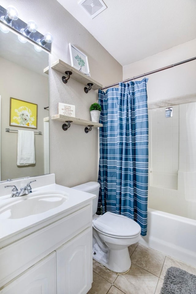 bathroom with tile patterned flooring, vanity, shower / tub combo with curtain, toilet, and visible vents