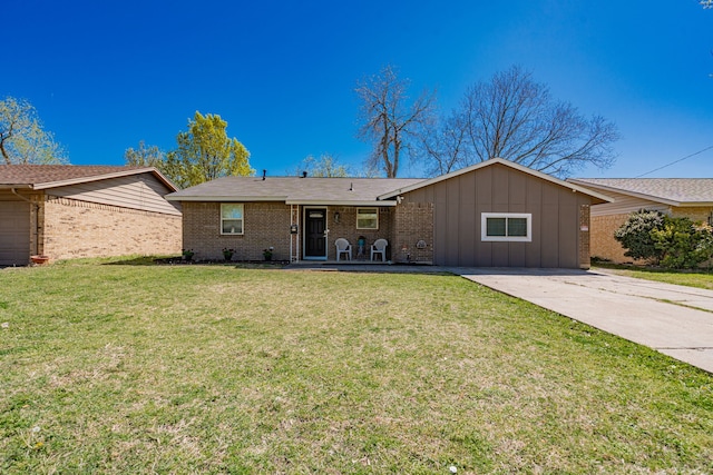 329 W Ferndale Ln, Grand Prairie, TX 75052 - ranch-style house with driveway, brick siding, a front lawn, and board and batten siding