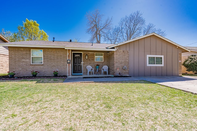 329 W Ferndale Ln, Grand Prairie, TX 75052 - ranch-style home featuring brick siding, board and batten siding, and a front yard