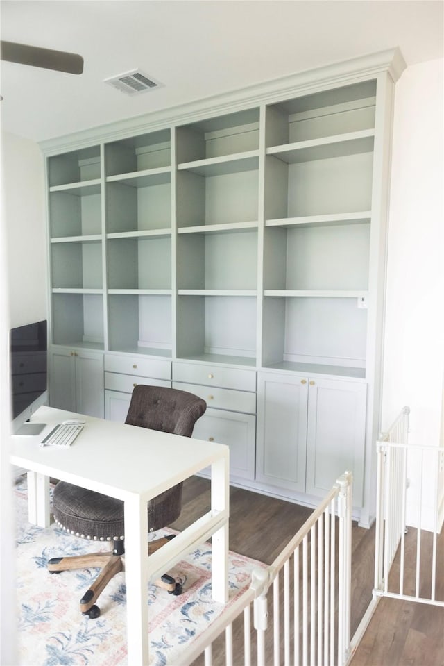 unfurnished office with dark wood-style flooring