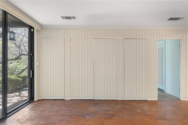 interior space featuring expansive windows and visible vents