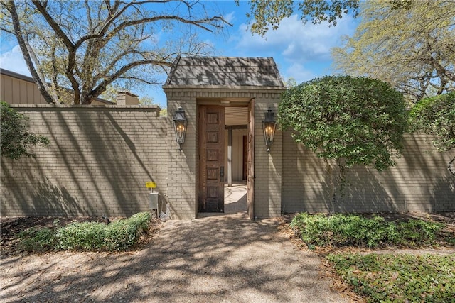 property entrance featuring fence