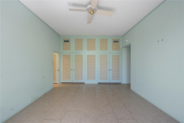 unfurnished room featuring french doors, light tile patterned floors, visible vents, and ceiling fan