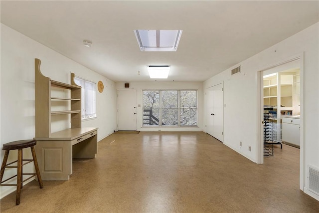 empty room with visible vents, light floors, and plenty of natural light