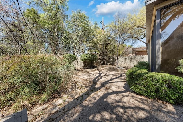 view of yard with fence and a patio area
