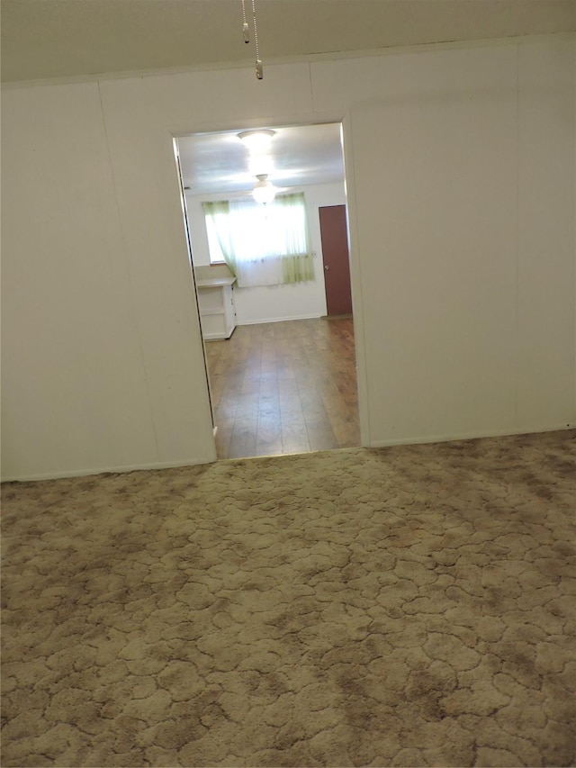 spare room featuring wood finished floors