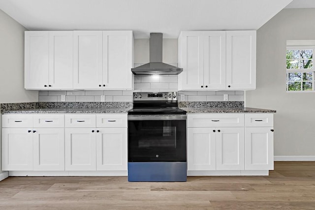 1541 Clark Ave, Waco, TX 76708 - kitchen featuring backsplash, wall chimney exhaust hood, dark stone countertops, and stainless steel electric range