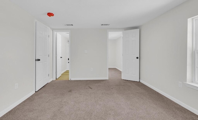 1541 Clark Ave, Waco, TX 76708 - carpeted empty room with baseboards and visible vents