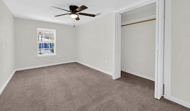 1541 Clark Ave, Waco, TX 76708 - unfurnished bedroom featuring a closet, visible vents, baseboards, ceiling fan, and dark carpet