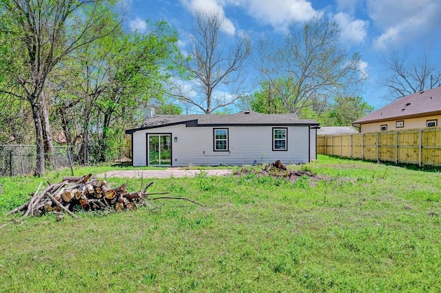 1541 Clark Ave, Waco, TX 76708 - back of property featuring a lawn and a fenced backyard