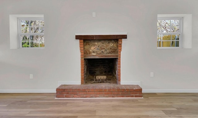 1541 Clark Ave, Waco, TX 76708 - details with baseboards, a fireplace, and wood finished floors