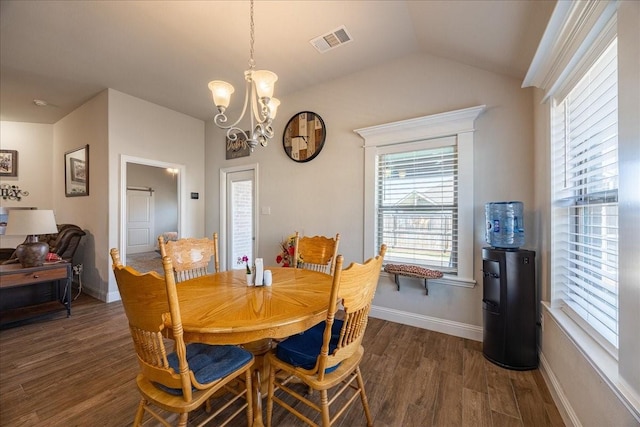 4711 Bering Dr, Sanger, TX 76266 - dining room featuring dark wood-style floors, a chandelier, lofted ceiling, and baseboards