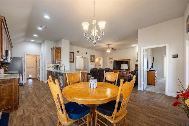 4711 Bering Dr, Sanger, TX 76266 - dining space with ceiling fan, dark wood-type flooring, a chandelier, vaulted ceiling, and baseboards