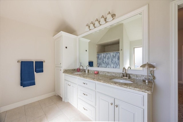 4711 Bering Dr, Sanger, TX 76266 - full bath with double vanity, lofted ceiling, baseboards, and curtained shower