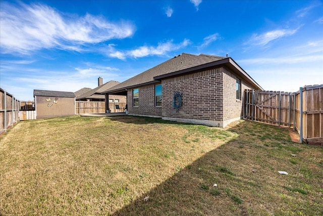 4711 Bering Dr, Sanger, TX 76266 - back of property with brick siding, a patio area, a shingled roof, and an outdoor structure