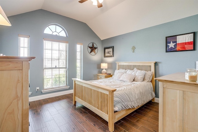 bedroom with baseboards, lofted ceiling, ceiling fan, and dark wood finished floors