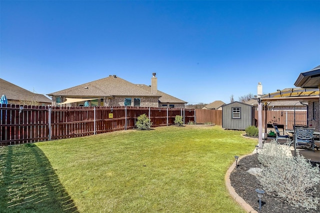 view of yard featuring an outbuilding, a patio, a fenced backyard, a pergola, and a storage shed