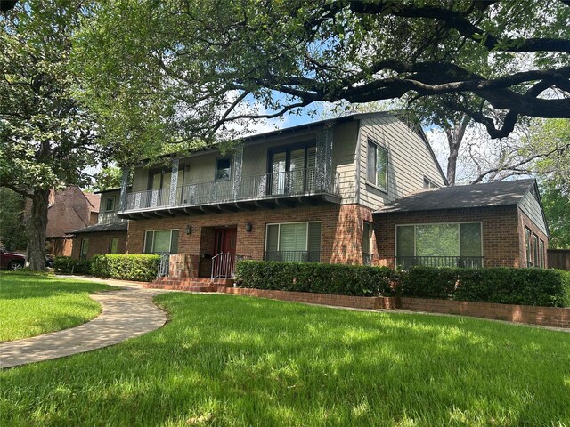 view of front of house with brick siding