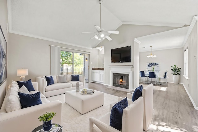 5300 Keller Springs Rd Unit 2044, Dallas, TX 75248 - living area featuring a fireplace with flush hearth, light wood-style flooring, ceiling fan with notable chandelier, and crown molding