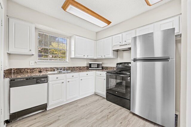 5300 Keller Springs Rd Unit 2044, Dallas, TX 75248 - kitchen with stainless steel appliances, under cabinet range hood, white cabinets, and light wood-type flooring