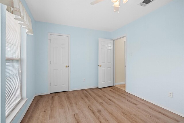 4629 Cripple Creek Rd, Haltom City, TX 76137 - unfurnished bedroom featuring visible vents, baseboards, ceiling fan, and wood finished floors