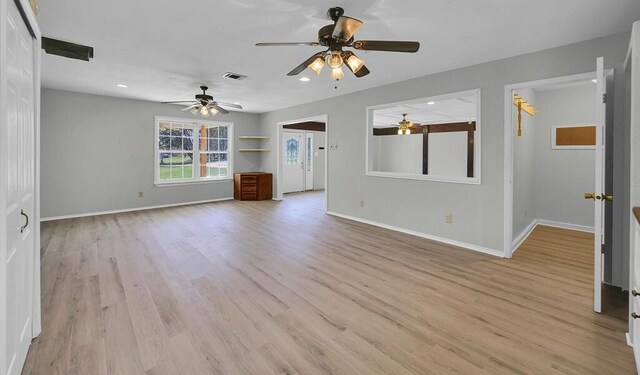 unfurnished living room featuring baseboards, recessed lighting, light wood-style floors, and ceiling fan