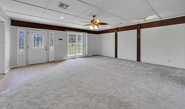 carpeted foyer with baseboards, visible vents, recessed lighting, a ceiling fan, and wood finished floors
