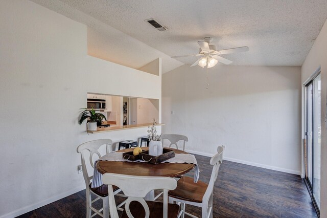1201 High Valley Dr, Garland, TX 75041 - dining space featuring a textured ceiling, a ceiling fan, vaulted ceiling, visible vents, and wood finished floors