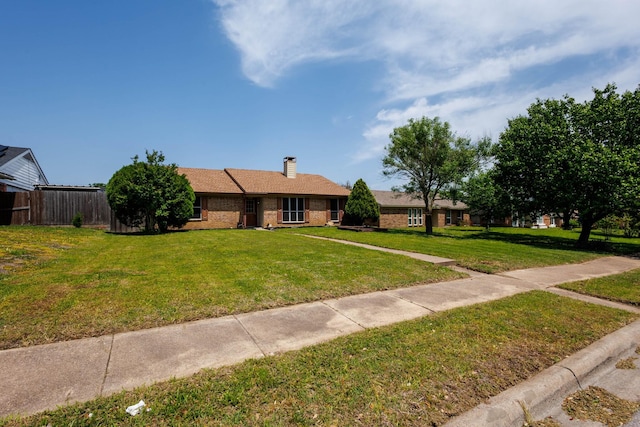 1201 High Valley Dr, Garland, TX 75041 - ranch-style house with a front yard, fence, brick siding, and a chimney