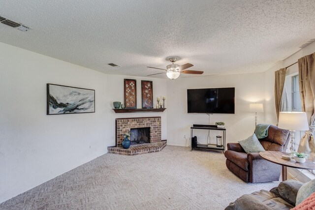 1201 High Valley Dr, Garland, TX 75041 - living area with visible vents, a ceiling fan, carpet flooring, and a textured ceiling