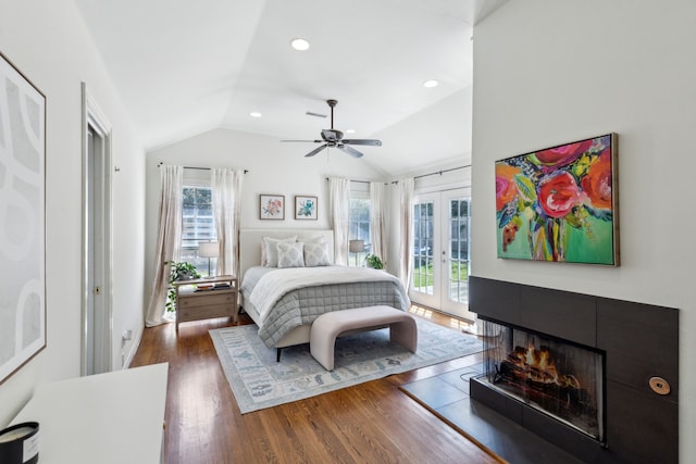 6926 Santa Monica Dr, Dallas, TX 75223 - bedroom with access to exterior, french doors, multiple windows, wood finished floors, and lofted ceiling