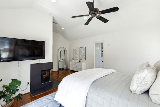 6926 Santa Monica Dr, Dallas, TX 75223 - bedroom featuring a ceiling fan, wood finished floors, lofted ceiling, a multi sided fireplace, and recessed lighting