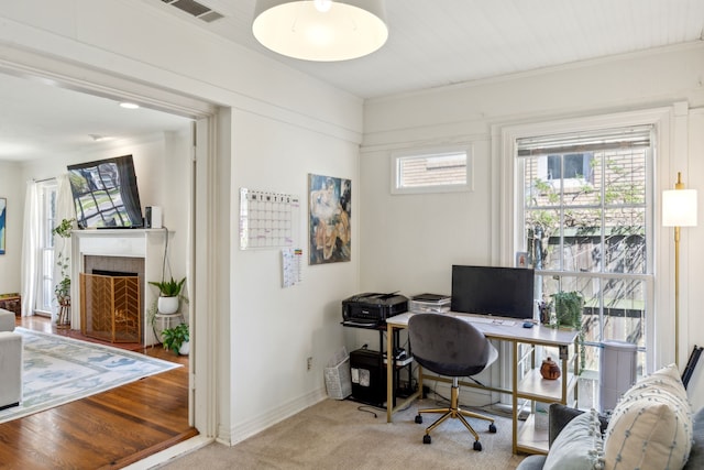 6926 Santa Monica Dr, Dallas, TX 75223 - carpeted office featuring baseboards, visible vents, and a warm lit fireplace