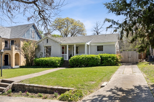 6926 Santa Monica Dr, Dallas, TX 75223 - view of front of property with brick siding, a front yard, and a gate