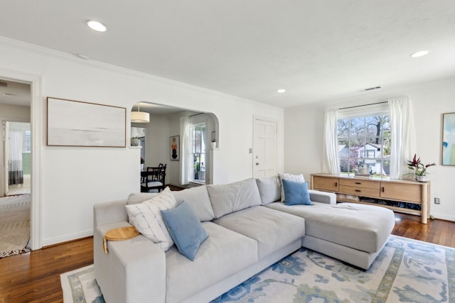 6926 Santa Monica Dr, Dallas, TX 75223 - living room featuring crown molding, recessed lighting, baseboards, arched walkways, and wood finished floors