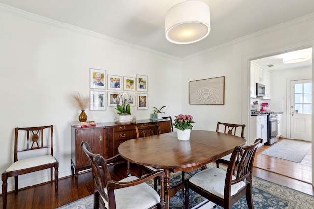 6926 Santa Monica Dr, Dallas, TX 75223 - dining space featuring ornamental molding and wood finished floors