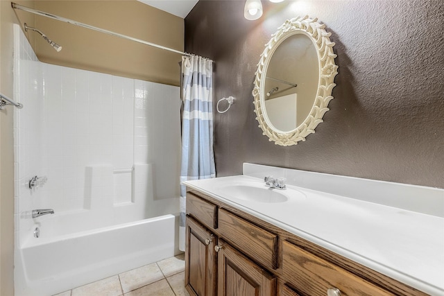 full bath with tile patterned flooring, vanity, and shower / tub combo