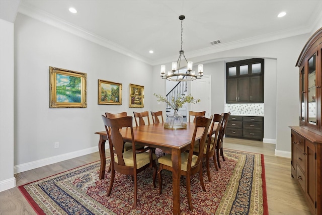 3905 Dashiell Dr, Flower Mound, TX 75022 - dining area featuring a chandelier, crown molding, recessed lighting, baseboards, and light wood-style flooring