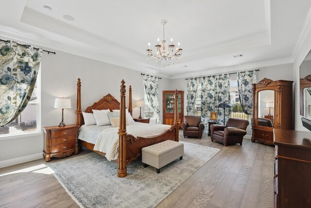 3905 Dashiell Dr, Flower Mound, TX 75022 - bedroom with a raised ceiling, light wood finished floors, multiple windows, and ornamental molding