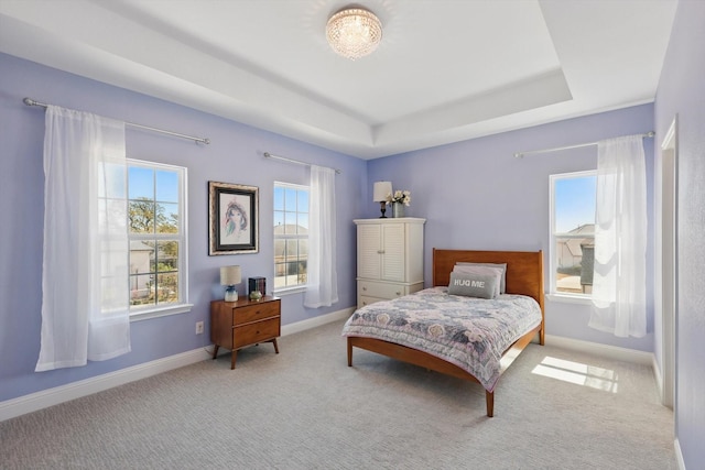 3905 Dashiell Dr, Flower Mound, TX 75022 - bedroom with multiple windows, a raised ceiling, carpet flooring, and baseboards